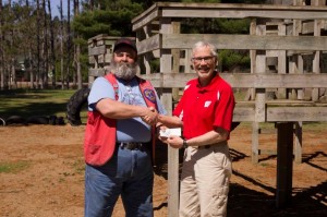Mel Severson of the Bruce Blue Hills Lion’s Club presents the Village President with a $5,000 check to go towards new Bruce Park playground equipment.